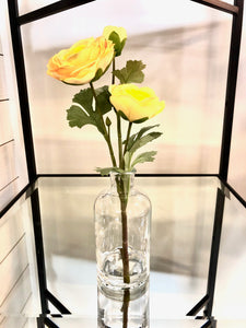 Yellow stem in Clear Vase